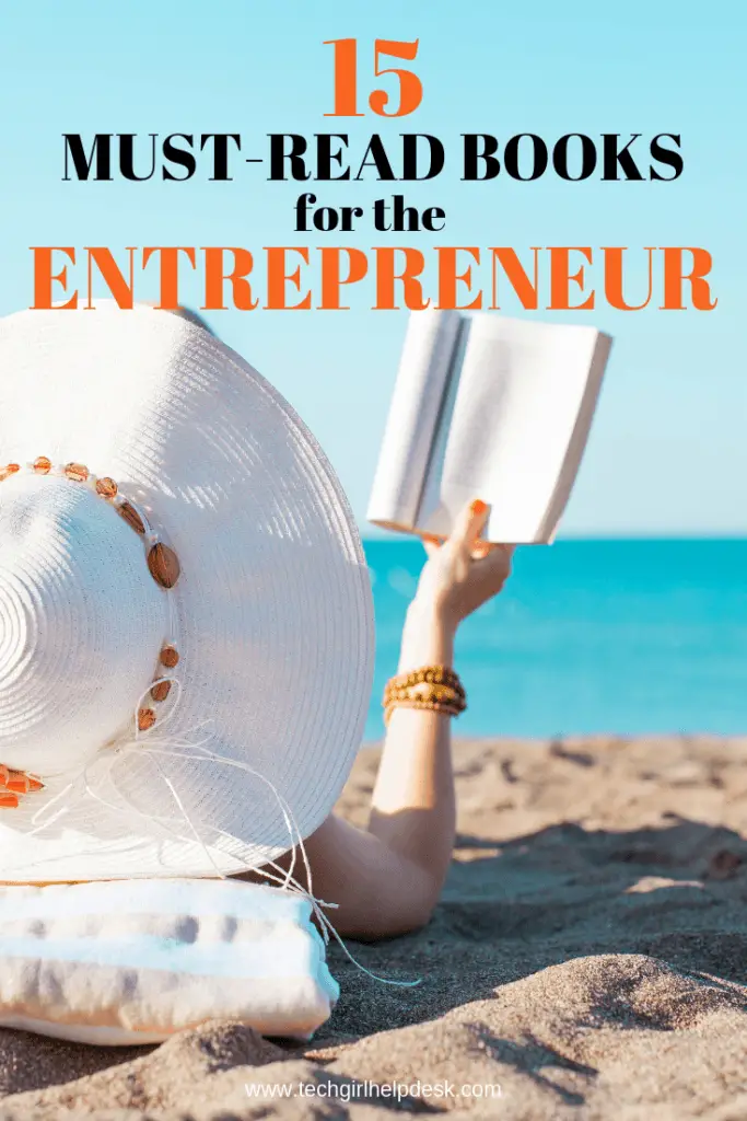 woman lying on the beach reading a book with a text overlay of 15 must read books for entrepreneurs